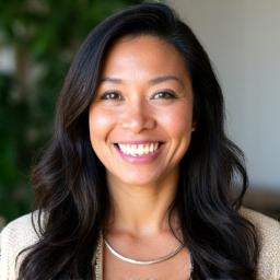 Headshot of Maria Garcia, a smiling female entrepreneur.